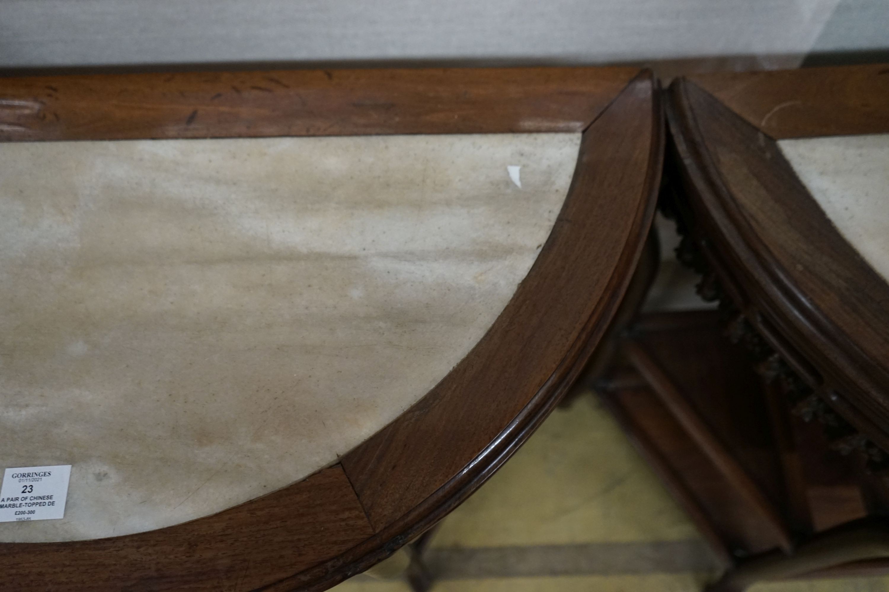 A pair of Chinese marble-topped demi lune console tables, width 82cm, depth 40cm, height 80cm